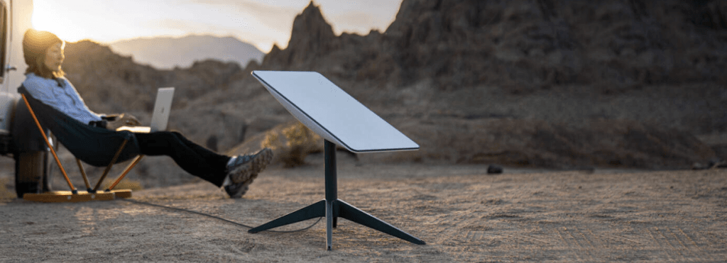 Starlink Roam dish set up at a remote campsite.