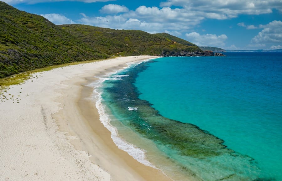 Empty white-sand beach with turquoise water at Shelley Beach inside D'Entrecasteaux National Park